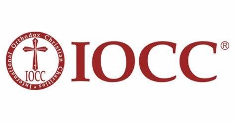 International Orthodox Christian Charities logo with a cross and IOCC text in red.